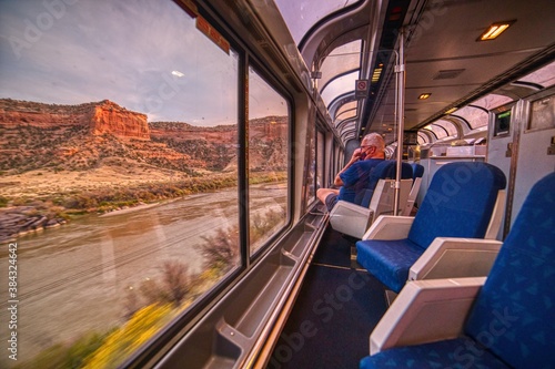 Amtrak Train crossing through the Colorado Rocky Mountains with peak Fall Colors in September