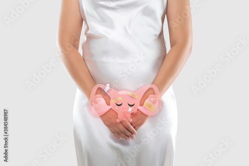 Illustration of the uterus is on the woman's body. Uterine Diseases. Endometriosis. People having belly ache