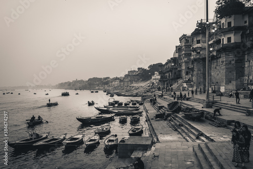 varanasi holy city of india during a foggy morning sunrise on ganga sacred river black and white