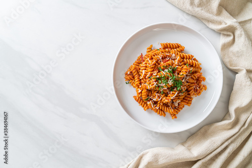 spirali or spiral pasta with tomato sauce