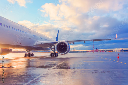 Evening view of a passenger plane wing with engine.