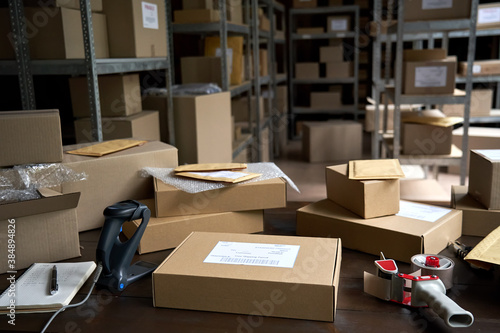 Distribution warehouse background, commercial shipping order boxes for dispatching on stockroom table, post courier delivery package, dropshipping commerce retail store shipment storage concept.