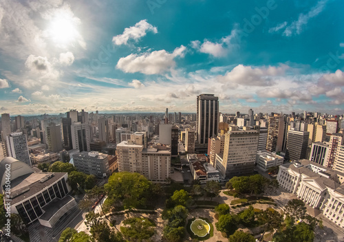 Aerial wide-angle landscape view of urbanized center with colorful skyscrapers in the morning - Santos Andrade Square - Curitiba, capital of Paraná State, Brazil