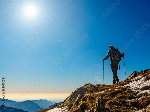 Trekking scene in winter on the alps of Como