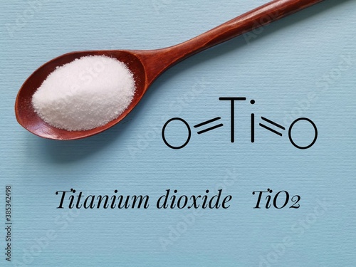 Structural chemical formula of titanium dioxide molecule with white titanium dioxide (TiO2) powder for cosmetic. It is inorganic chemical compound, widely used as a commercial white pigment.