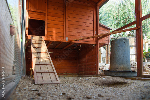 Interior of a dirty empty chicken coop.