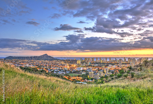 Enjoying the view of Diamond Head and the city lights overlooking Honolulu and Waikiki at sunset