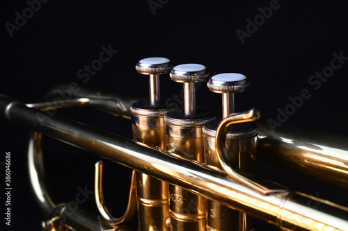 Brass instruments, golden trumpet in the dark