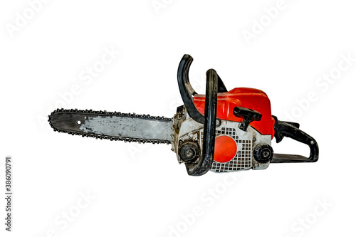 Old dirty shabby chainsaw isolated on white background - side view. Working gasoline tool for sawing wood