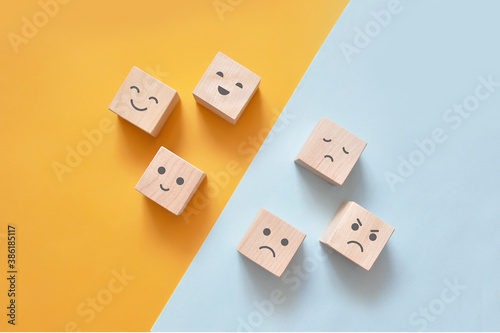 Image of different emotions on wooden cubes.