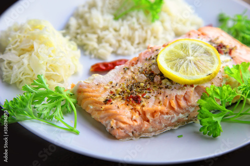healthy baked fish salmon with rice and sauerkraut