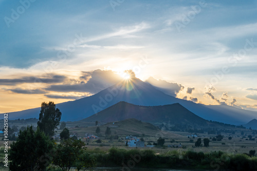 Countryside landscape with popocatepetl volcano in Mexico during sunset