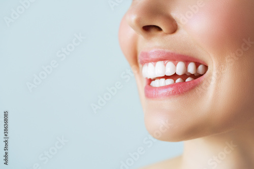 Perfect healthy teeth smile of a young woman. Teeth whitening. Dental care, stomatology concept.