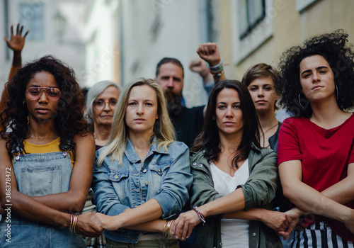 Group of people activists protesting on streets, women march and demonstration concept.