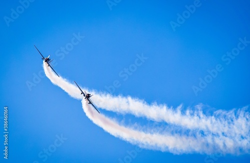 two jets with contrails in airshow