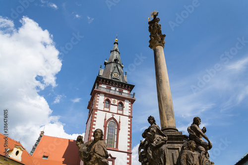 Sightseeing tower of the late gothic decanal Church of the Assumption of the Virgin Mary in Chomutov, Usti nad Labem region, Czech Republic, sunny summer day, clear blue sky background