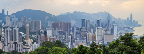 Panorama view of Sunset in city Skyline of Hong Kong Island (south of Victoria Harbour) from Braemar hill, North Point