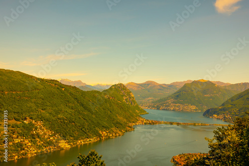 Aerial View over Lugano with Alpine Lake and Mountain in a Sunny Day in Ticino, Switzerland.