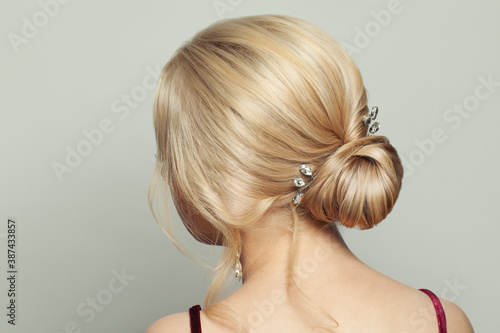 Pretty blonde woman back with perfect hairstyle