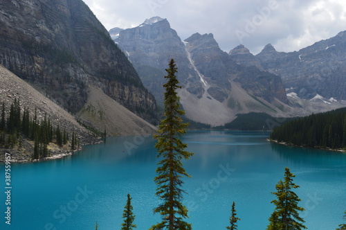 The turquoise Moraine Lake and the waterfalls and nature of the Rocky Mountains in British Columbia, Canada