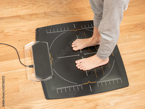 Feet of a young boy on a podiatrist pressure plate