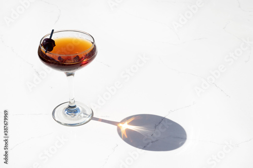 Classic Cocktail in a coupe glass with reflection