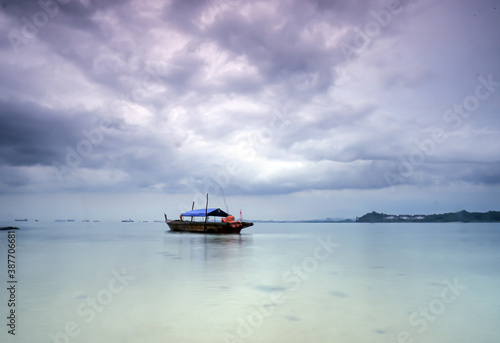 boat on the sea with cloudy