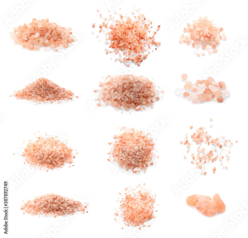 Piles of pink himalayan salt on white background