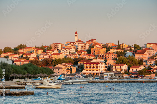 Small Mediterranean town Seget Donji near the Trogir town at sunset, Croatia