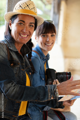 female photographer and friend travelling together