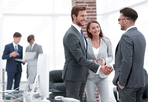 handshake business partners at a meeting