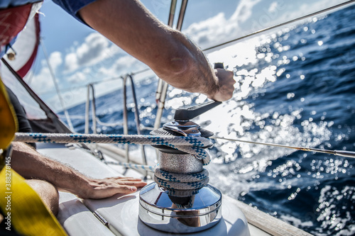 Rope hauling on the winch, on the yacht.