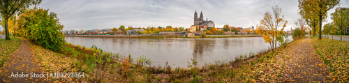 Panoramic view over downtown of Magdeburg, old town, Elbe river and Magnificent Cathedral at early Autumn and warm sunset, Magdeburg, Germany.