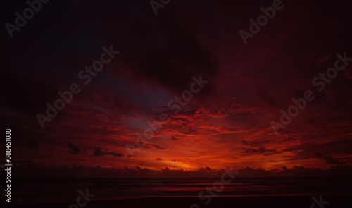 Nature background. Shot of Landscape amazing of red sky sunset in the sea with red clouds background. Travel concept.