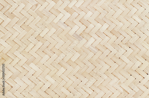 Old bamboo weaving pattern, woven rattan mat texture for background and design art work.