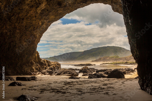 Sea cave arch at Bethells beach