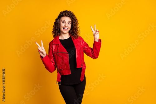 Portrait of her she nice attractive cheerful cheery wavy-haired girl showing double v-sign isolated on bright vivid yellow color background