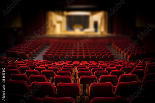 Empty red armchairs of a theater ready for a show