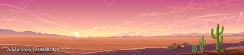 Panoramic view of a desert sunset. A wide view of a large landscape with some vegetation.