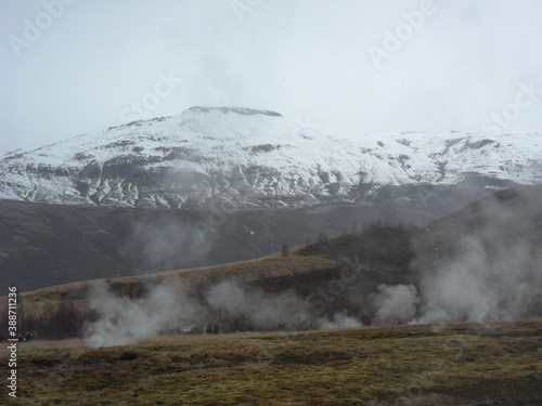 Hiking in the wild and dramatic landscapes of Iceland's snowy mountains, volcanoes, geysers, waterfalls and hot springs