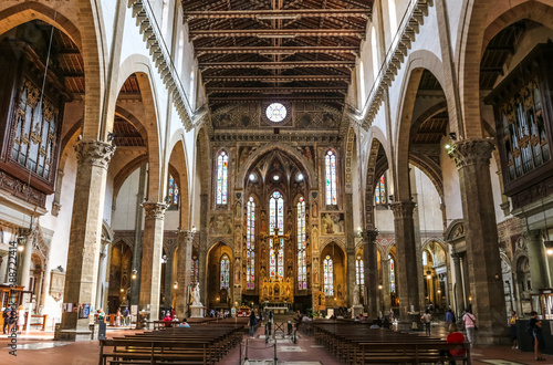 Lovely view from the nave to the transept, chancel and apse with the main chapel inside the famous Basilica of Santa Croce in Florence, Tuscany, Italy.