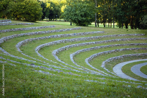 original amphitheater of grass and stones in the park