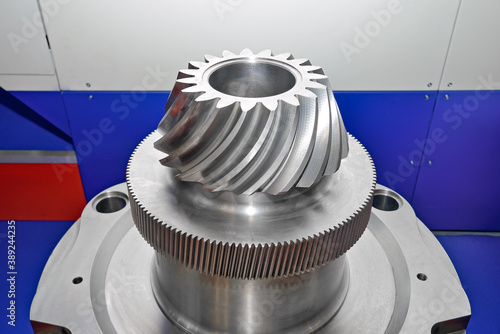 Industrial conical gear, cogwheel with spiral machine teeth. Macro shooting