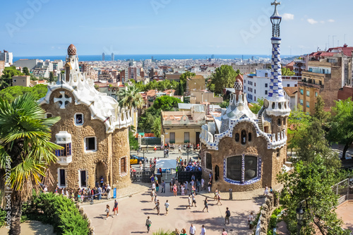 Spain. Barcelona - 31 AUGUST 2014. Gingerbread houses from Park Guell and Panoramic view of Barcelona. Beautiful view of Barcelona city in summer day, Spain