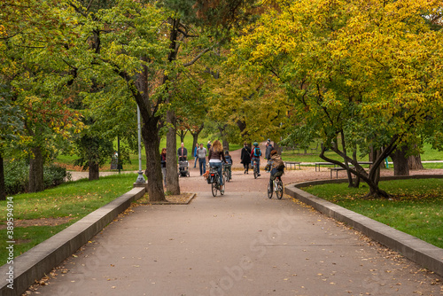 Group of friends are riding on bicycle and having a good time on Letna Park in Autumn 2020 on Prague 6, during quarantine period due to outbreak of COVID-19 as winter is starting, Czech Republic