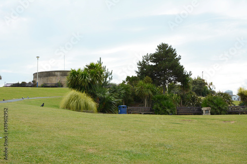 Grass slope with seating in front of historic Redoubt fortress in Eastbourne