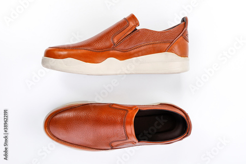 Men's comfortable brown leather shoes on white background
