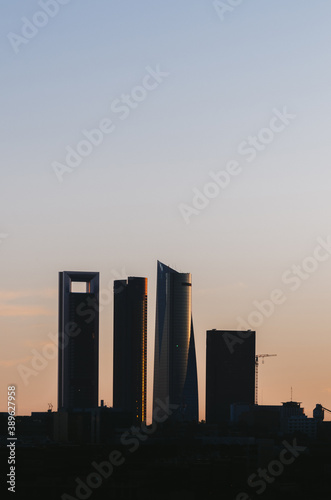 Sunset financial district of Cuatro Torres towers silhouette in Madrid, Spain