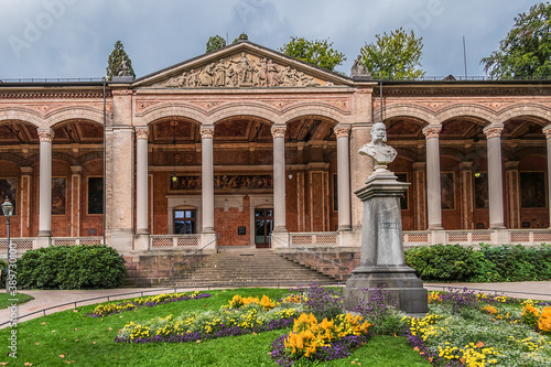 View of Trinkhalle building (pump house, 1839 - 1842) in the Baden-Baden Kurhaus spa complex. 16 Corinthian columns support the 90-meter long, open-plan lobby with 14 murals. Baden-Baden, Germany.