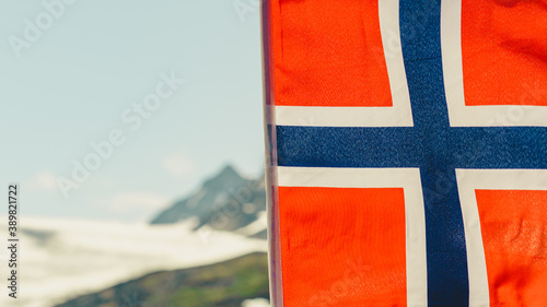 Norwegian flag and mountains snowy landscape